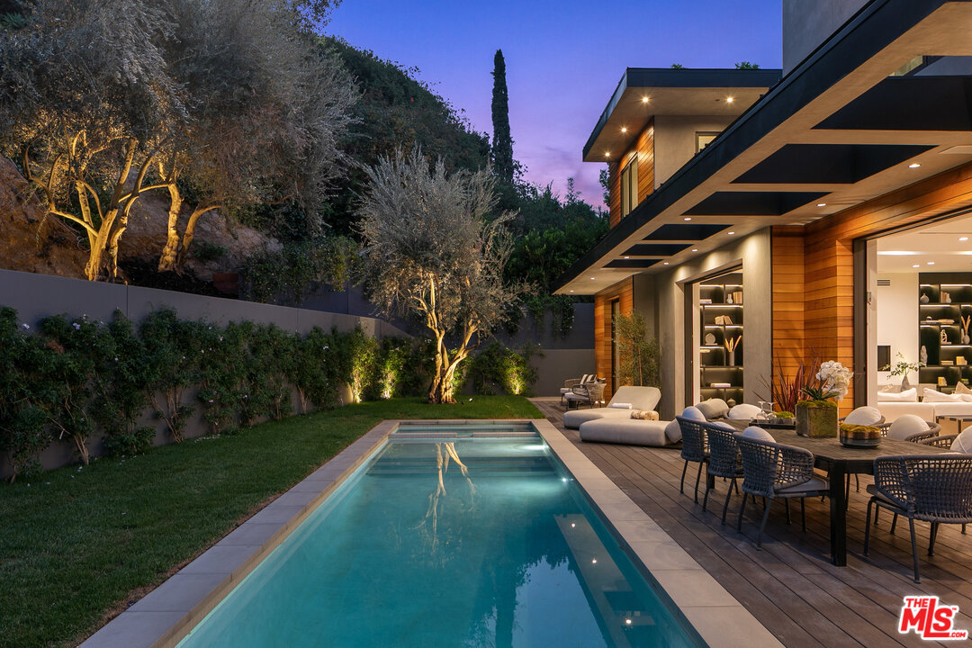 1461 Rising Glen Road Los Angeles, CA 90069 - Photo 3 of 22 a view of a house with backyard porch and sitting area