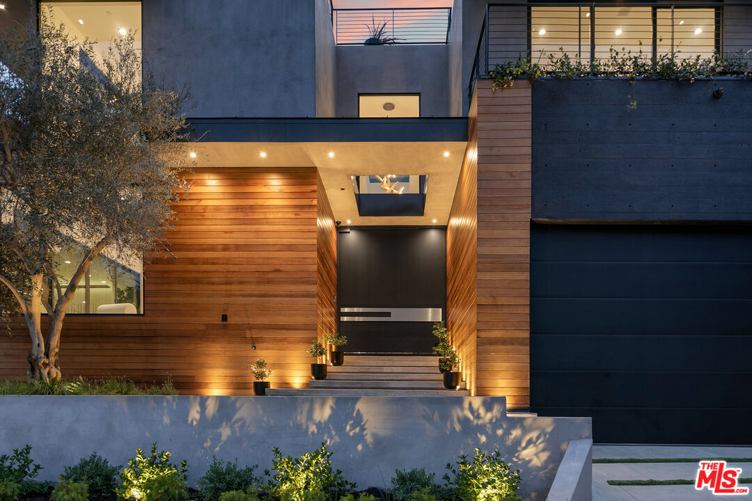 1461 Rising Glen Road Los Angeles, CA 90069 - Photo 5 of 22 a view of building with wooden door