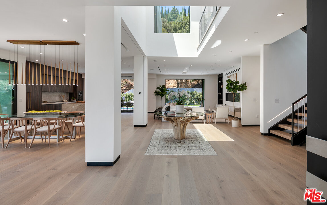 1461 Rising Glen Road Los Angeles, CA 90069 - Photo 6 of 22 a living room with furniture oven and a table