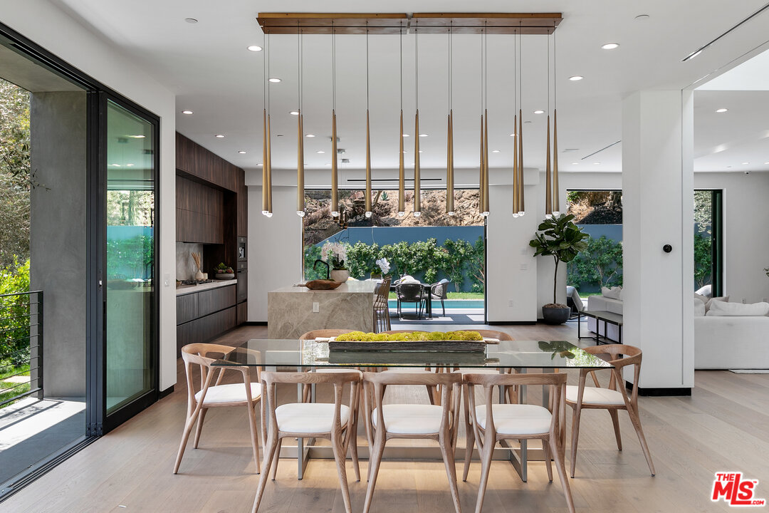 1461 Rising Glen Road Los Angeles, CA 90069 - Photo 7 of 22 a view of a dining room with furniture window and wooden floor