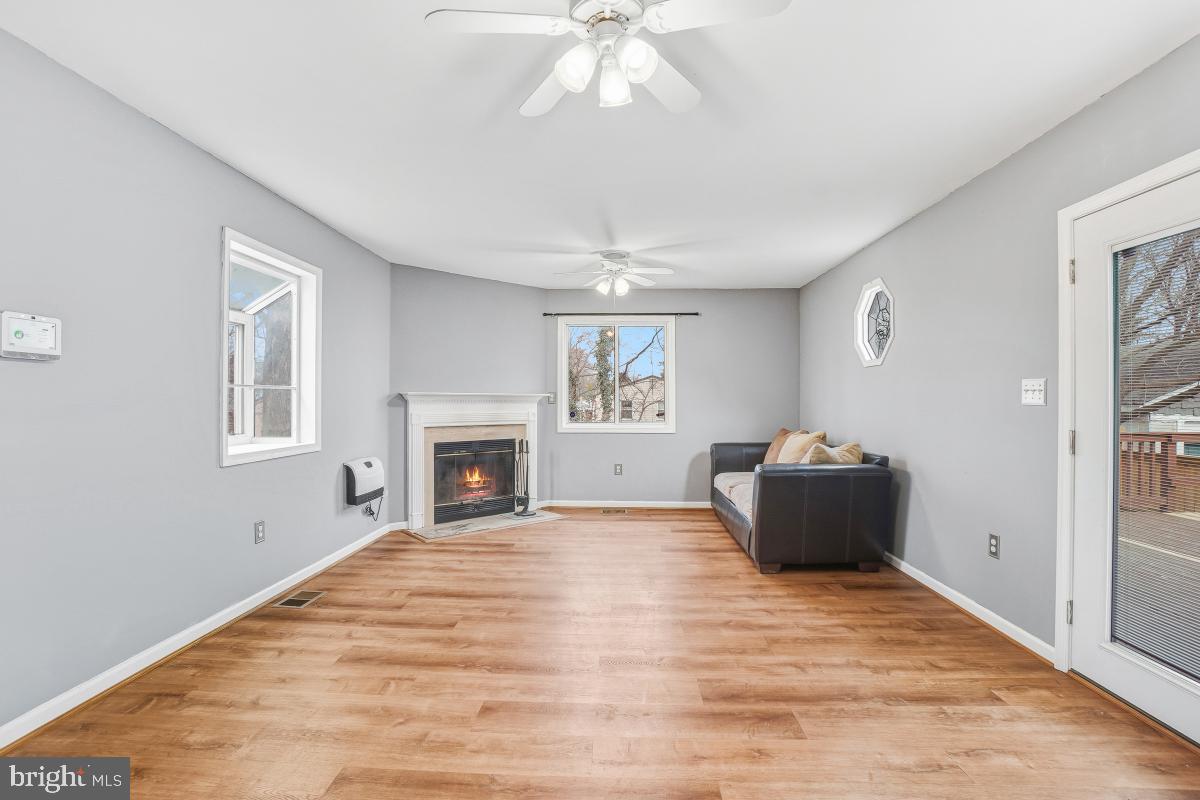 4810 Odell Road Beltsville, MD 20705 - Photo 13 of 30 a view of empty room with fireplace and windows