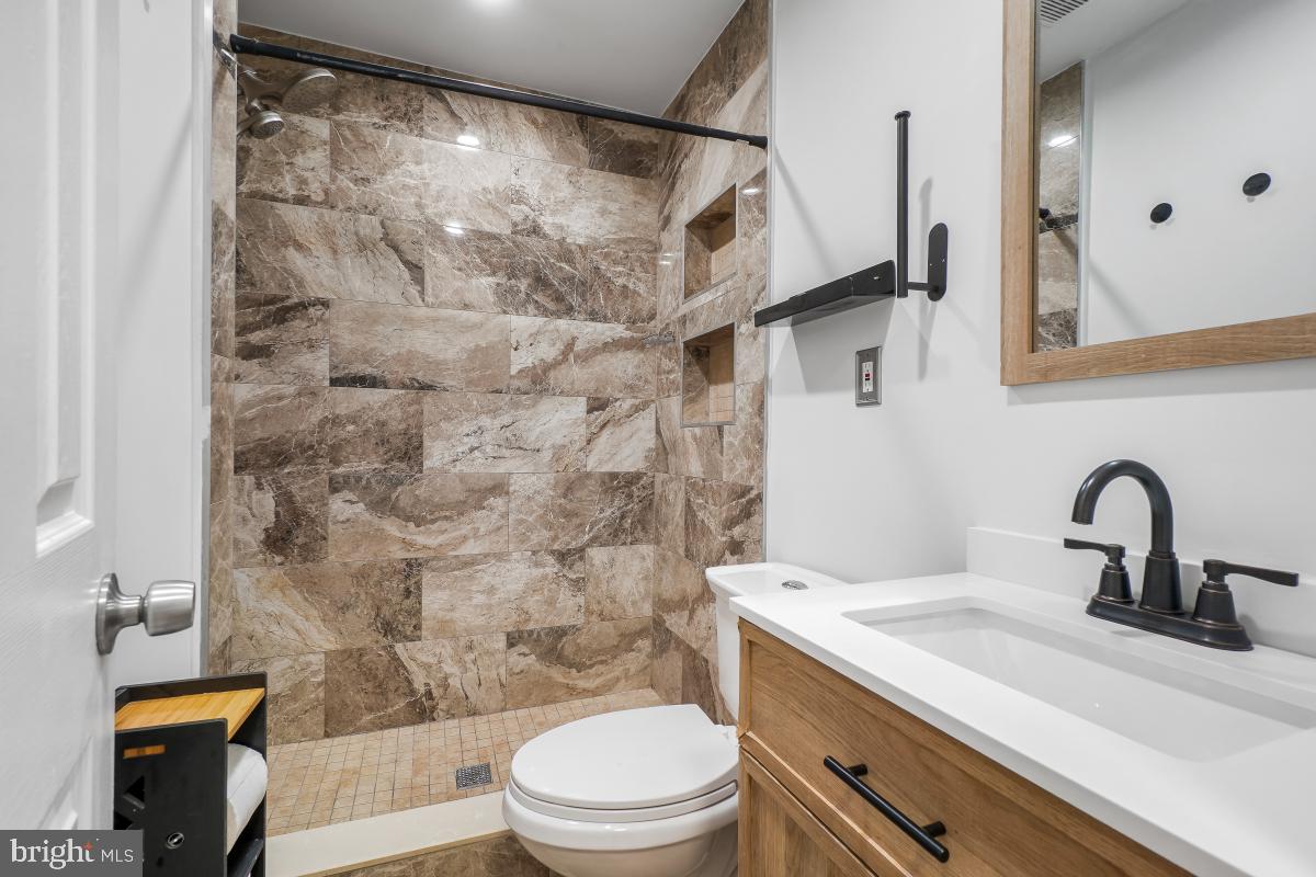 4810 Odell Road Beltsville, MD 20705 - Photo 15 of 30 a bathroom with a sink toilet and shower