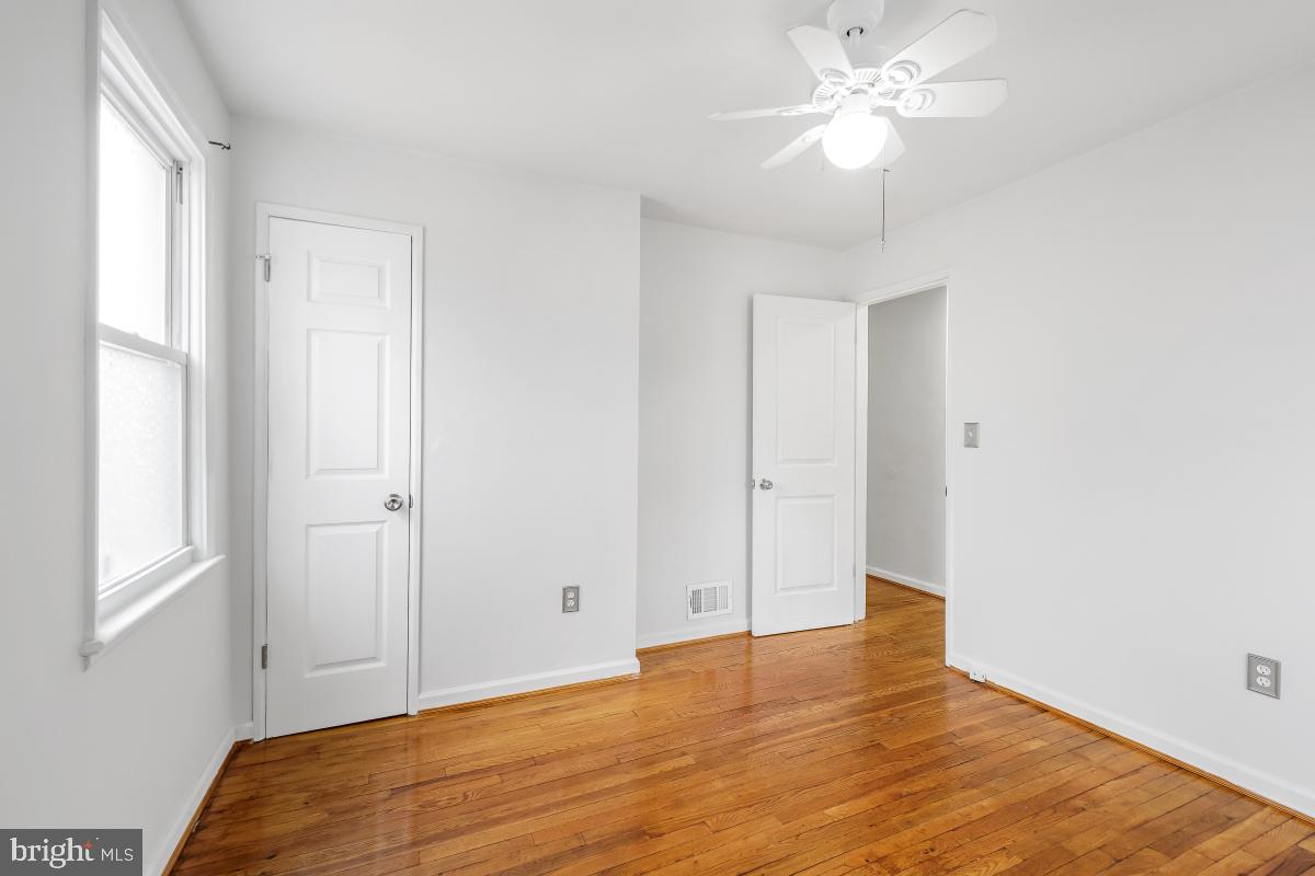 4810 Odell Road Beltsville, MD 20705 - Photo 17 of 30 a view of empty room with wooden floor and fan