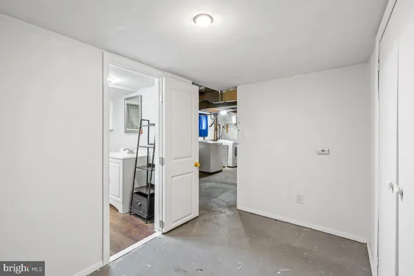 a bathroom with a sink a vanity and a shower