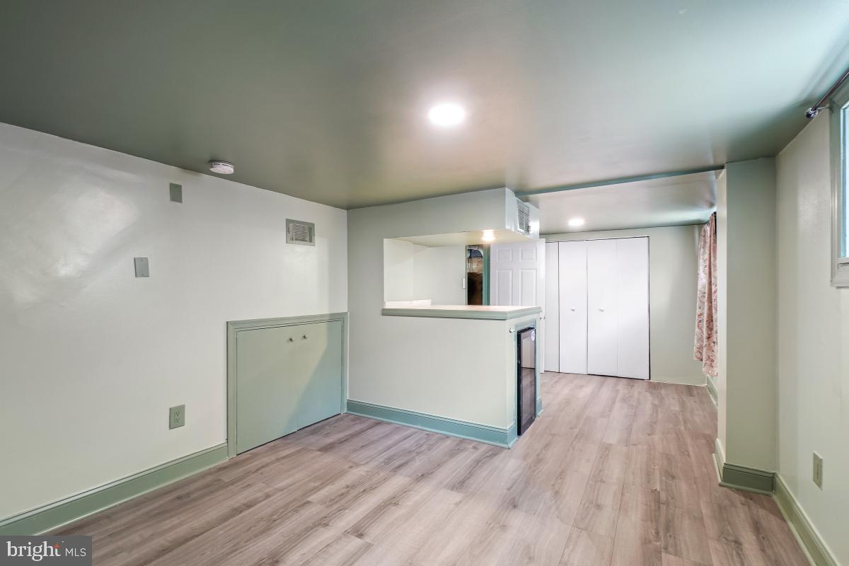 4810 Odell Road Beltsville, MD 20705 - Photo 24 of 30 a view of a kitchen with wooden floor and a sink