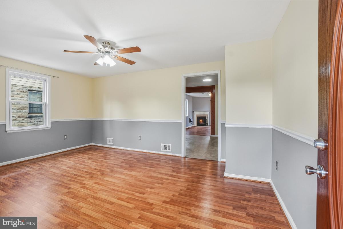 4810 Odell Road Beltsville, MD 20705 - Photo 4 of 30 a view of empty room with wooden floor and fan