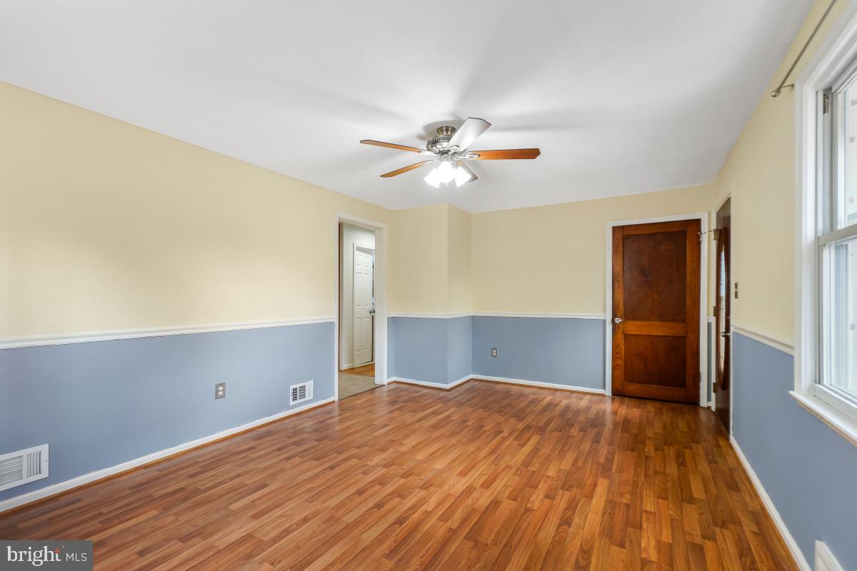 4810 Odell Road Beltsville, MD 20705 - Photo 7 of 30 a bedroom with a bed and a ceiling fan