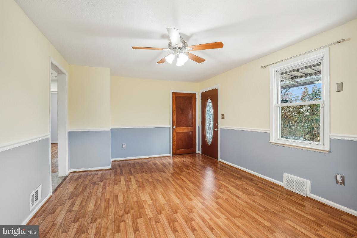 4810 Odell Road Beltsville, MD 20705 - Photo 8 of 30 a view of empty room with wooden floor and fan