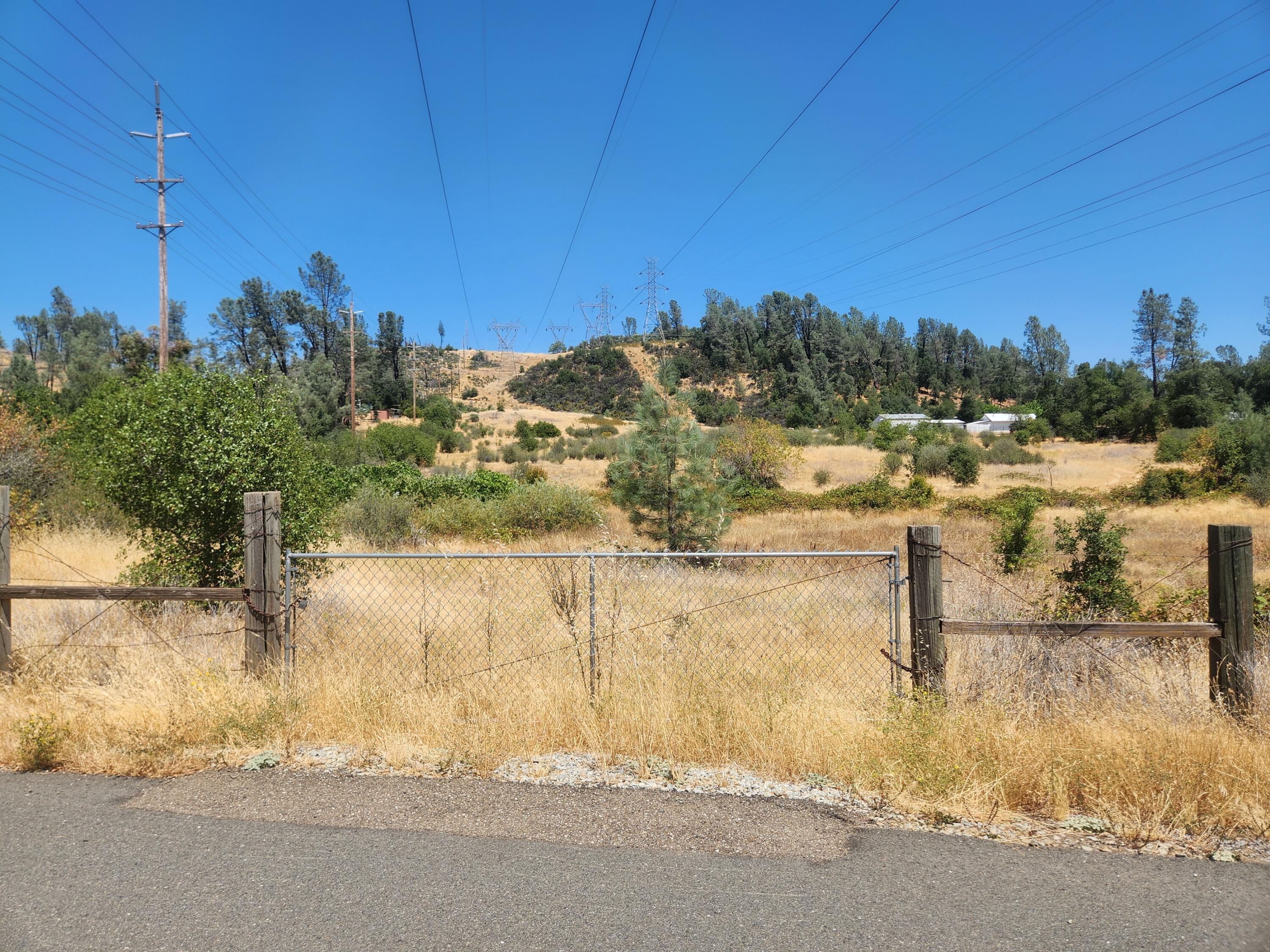 Thompson Lane Redding, CA 96001 - Photo 4 of 6 a view of a lake with a house in the background