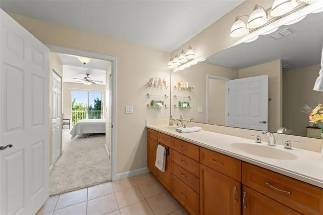 a spacious bathroom with a double vanity sink mirror and double
