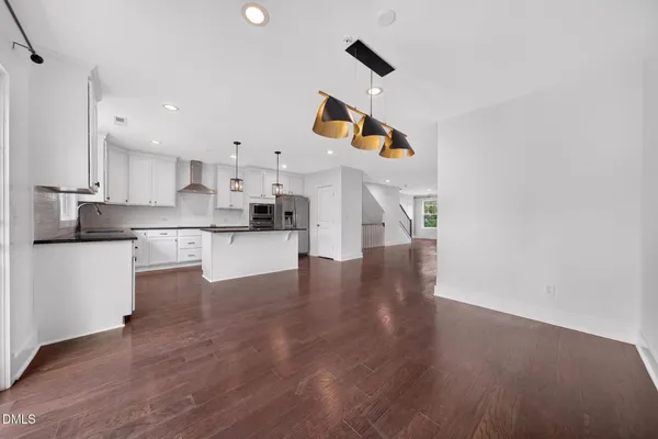 a view of kitchen with wooden floor and window