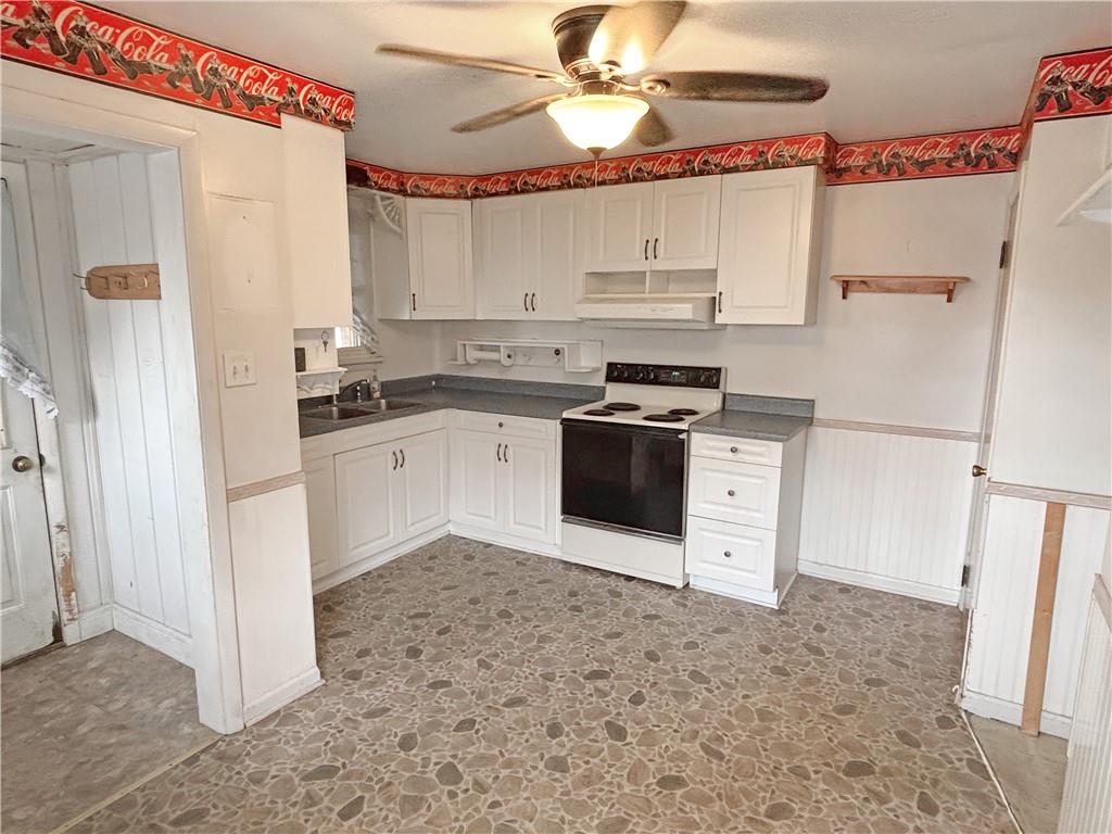 1701 Indiana Avenue Monaca, PA 15061 - Photo 11 of 33 a kitchen with a stove a refrigerator and a sink