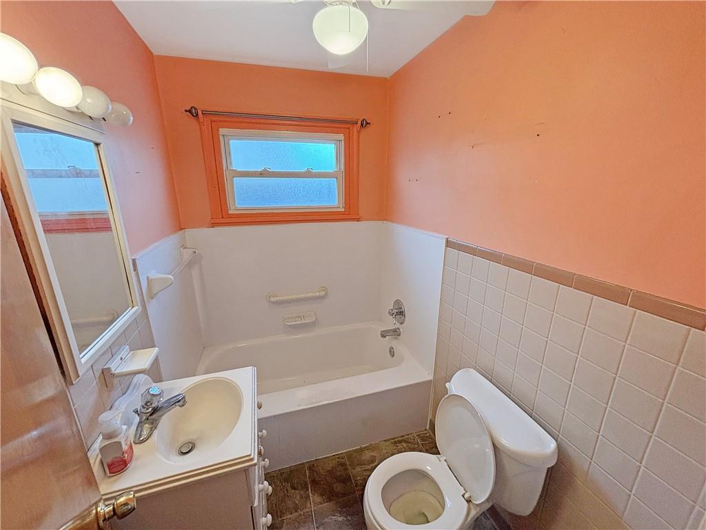 1701 Indiana Avenue Monaca, PA 15061 - Photo 14 of 33 a bathroom with a sink a toilet and bathtub