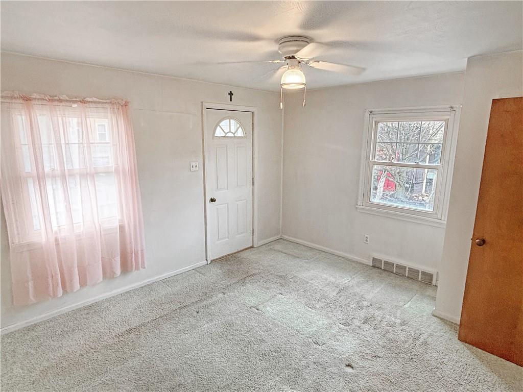 1701 Indiana Avenue Monaca, PA 15061 - Photo 19 of 33 an empty room with windows and fan