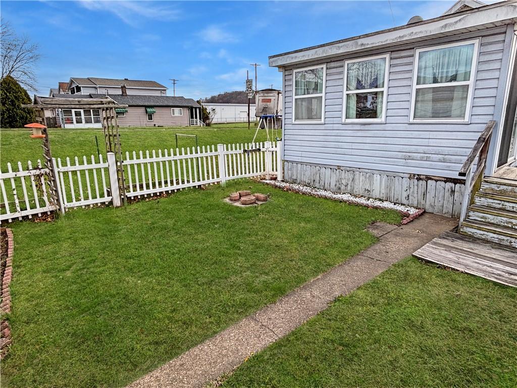1701 Indiana Avenue Monaca, PA 15061 - Photo 30 of 33 a view of a house with a yard and a wooden deck