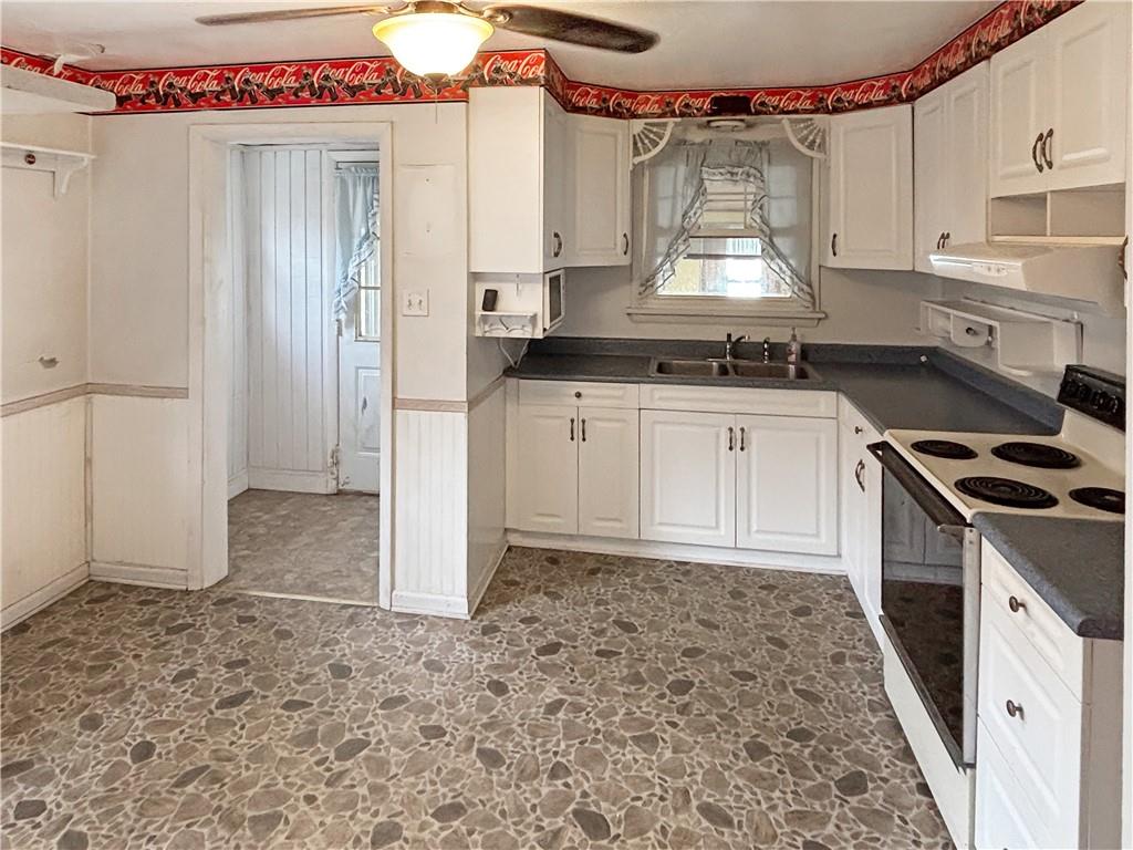 1701 Indiana Avenue Monaca, PA 15061 - Photo 10 of 33 a kitchen with a stove and a refrigerator