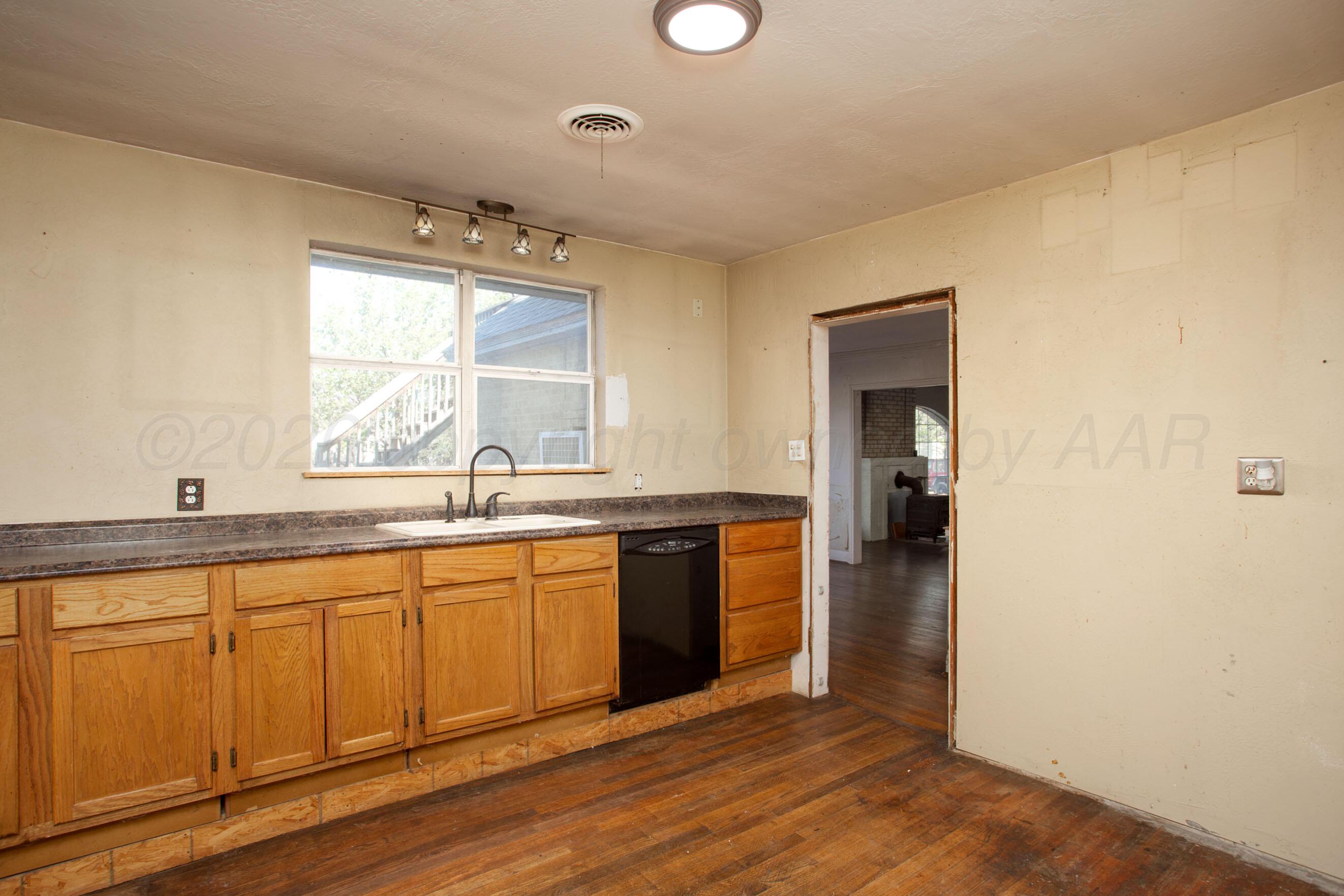4223 Southwest 11th Avenue Amarillo, TX 79106 - Photo 12 of 26 a view of a kitchen counter space and windows