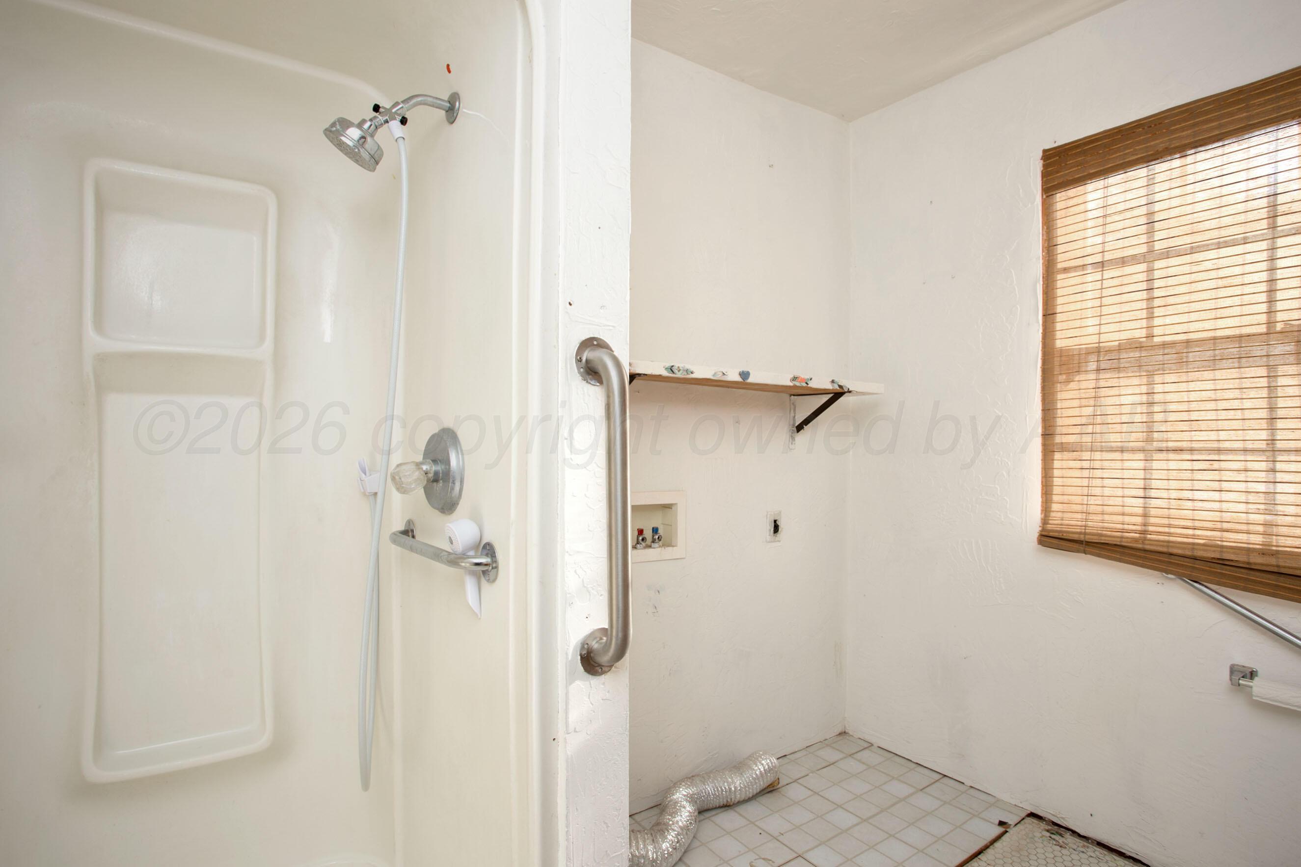 4223 Southwest 11th Avenue Amarillo, TX 79106 - Photo 23 of 26 a bathroom with a shower