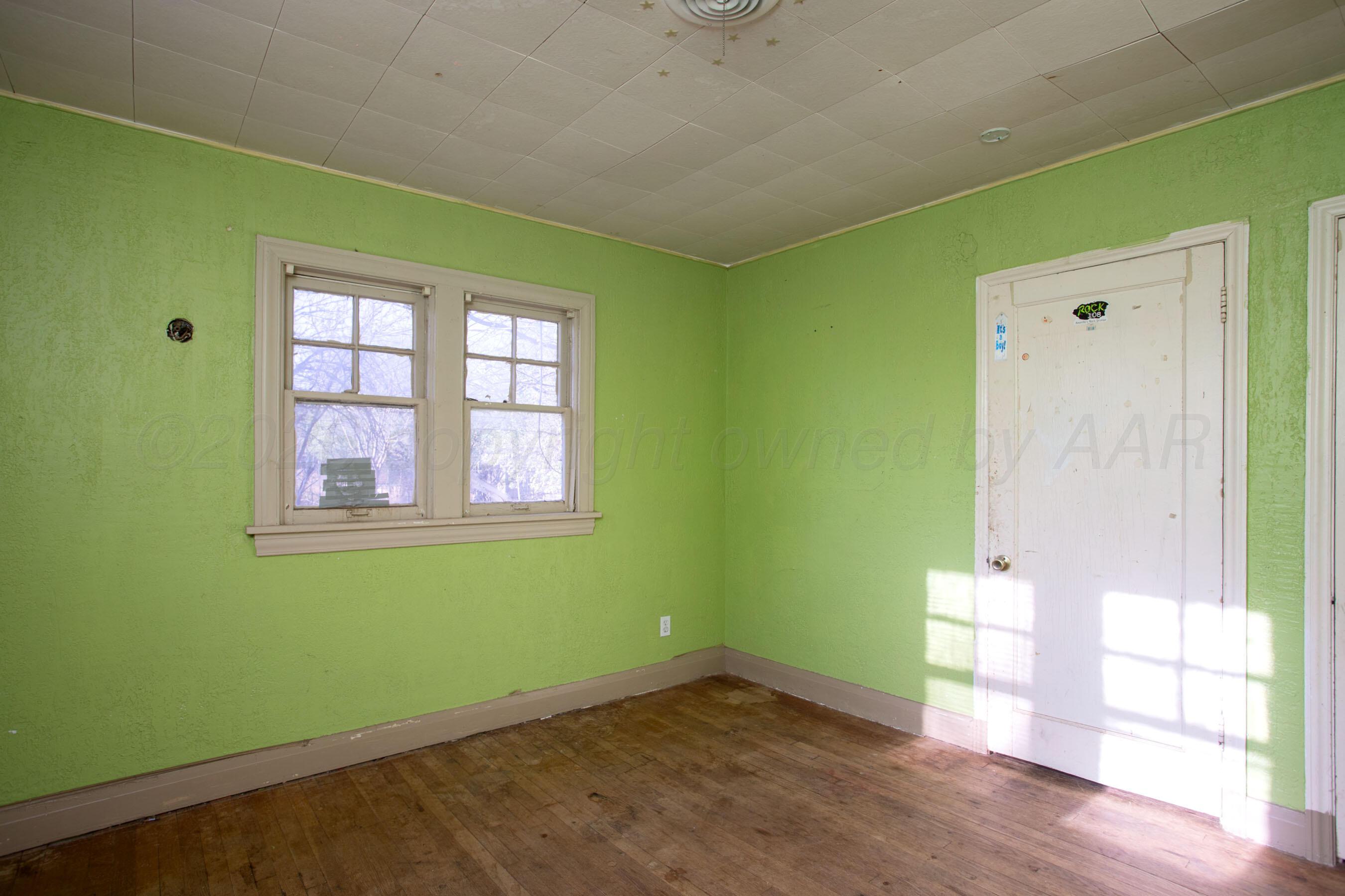 4223 Southwest 11th Avenue Amarillo, TX 79106 - Photo 25 of 26 a view of empty room with wooden floor and fan