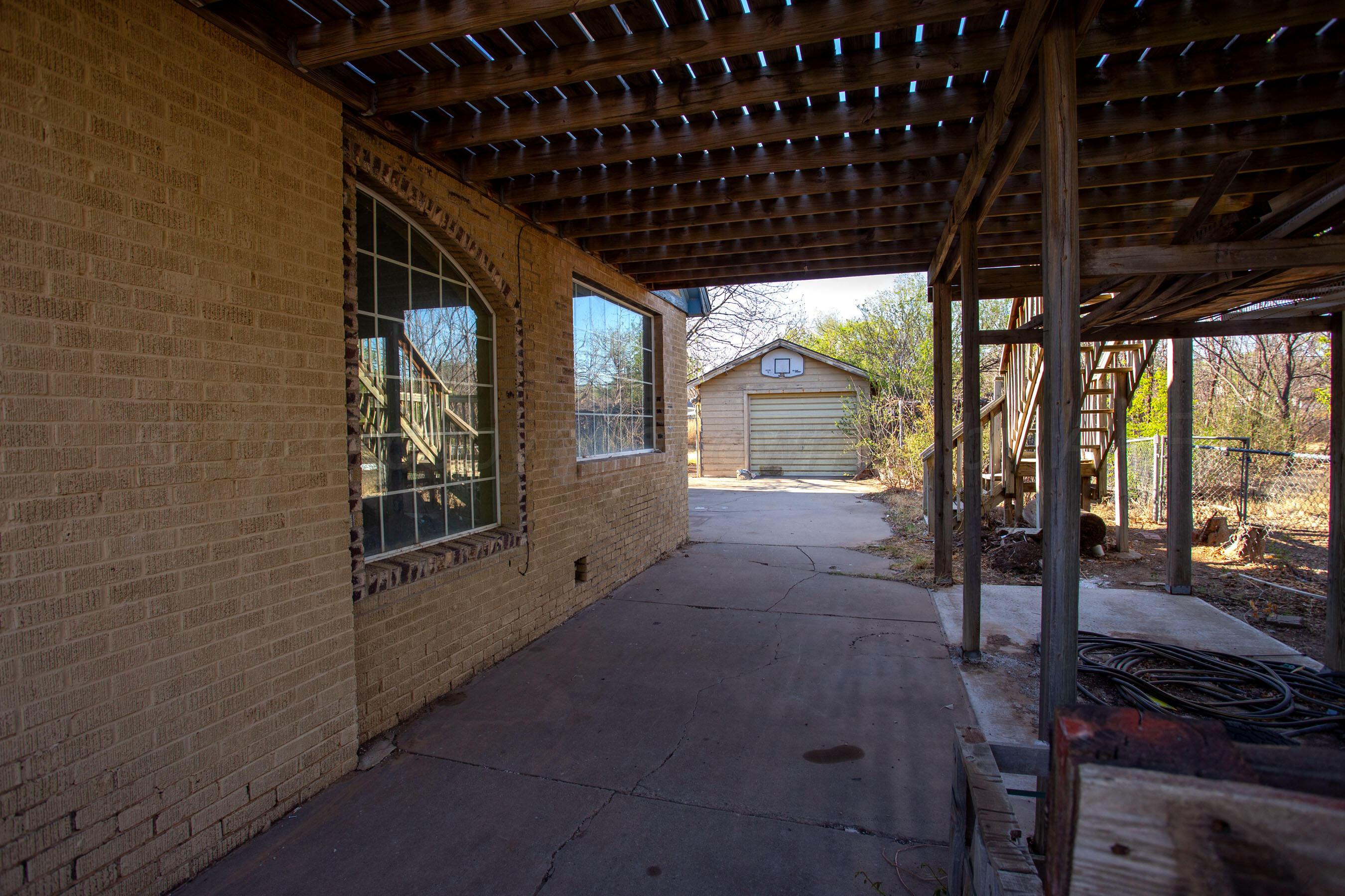 4223 Southwest 11th Avenue Amarillo, TX 79106 - Photo 4 of 26 a view of a porch with chairs