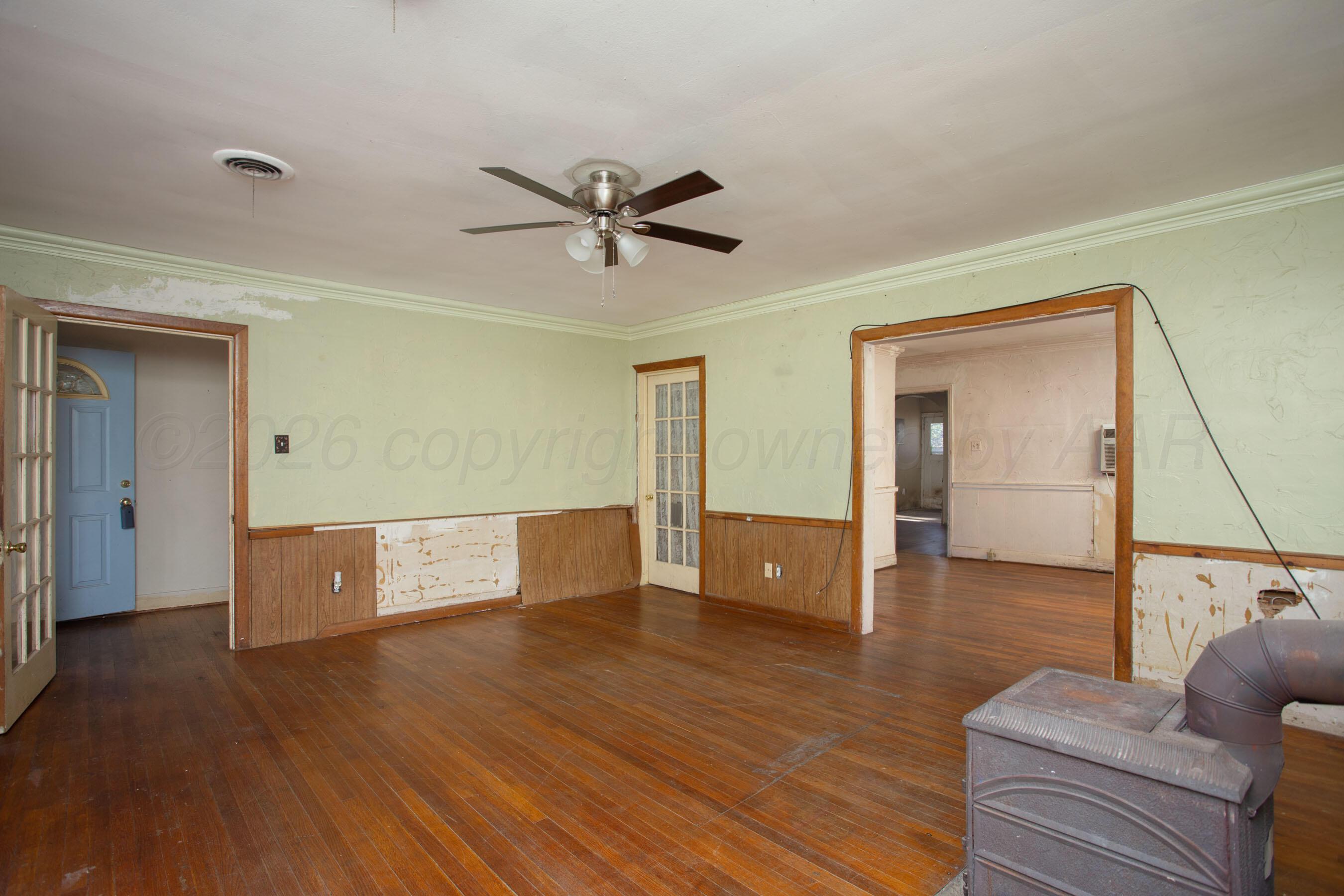 4223 Southwest 11th Avenue Amarillo, TX 79106 - Photo 7 of 26 a living room with furniture and a wooden floor