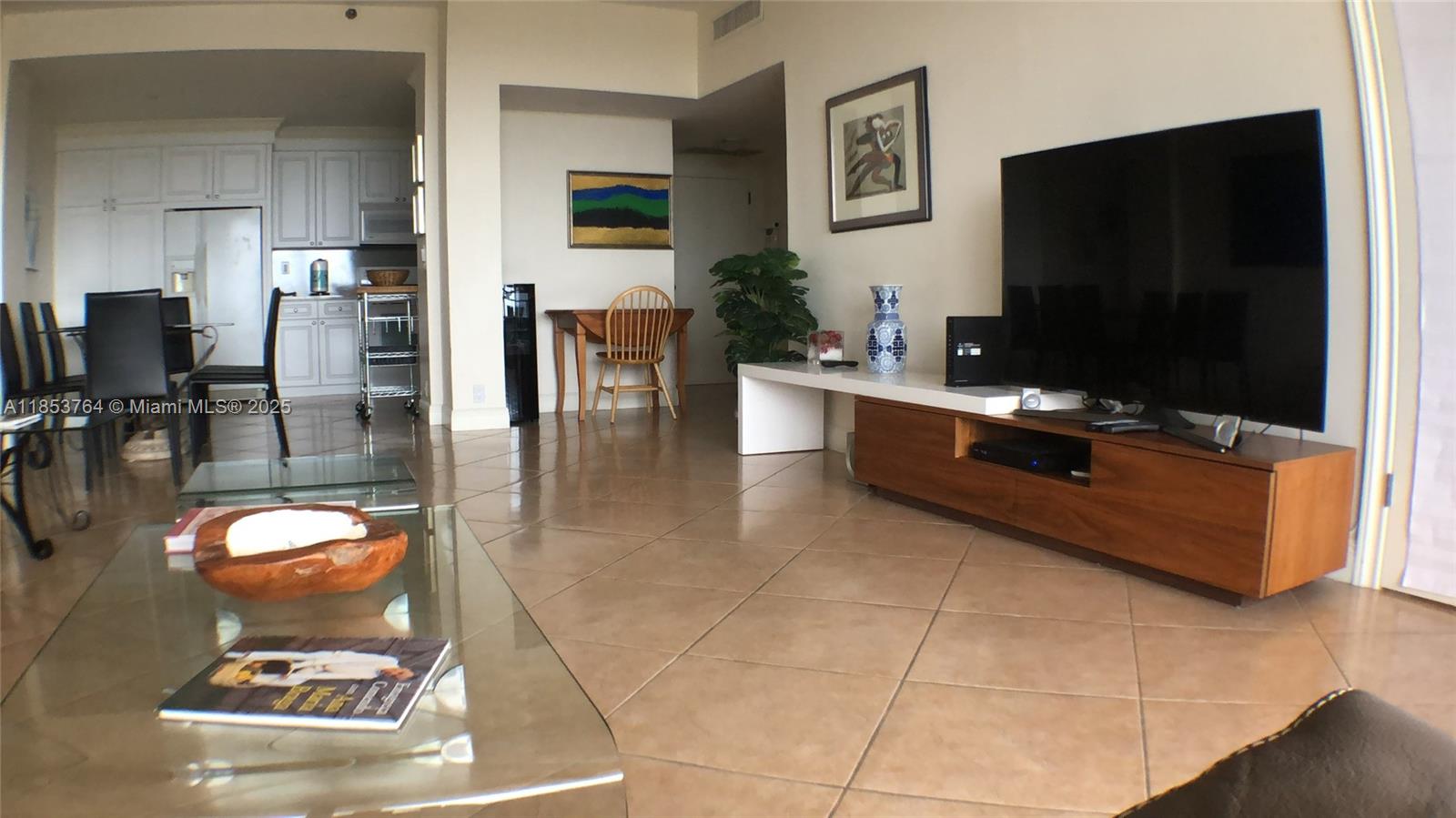 151 Crandon Boulevard, Unit 833 Key Biscayne, FL 33149 - Photo 6 of 12 a living room with furniture and a flat screen tv