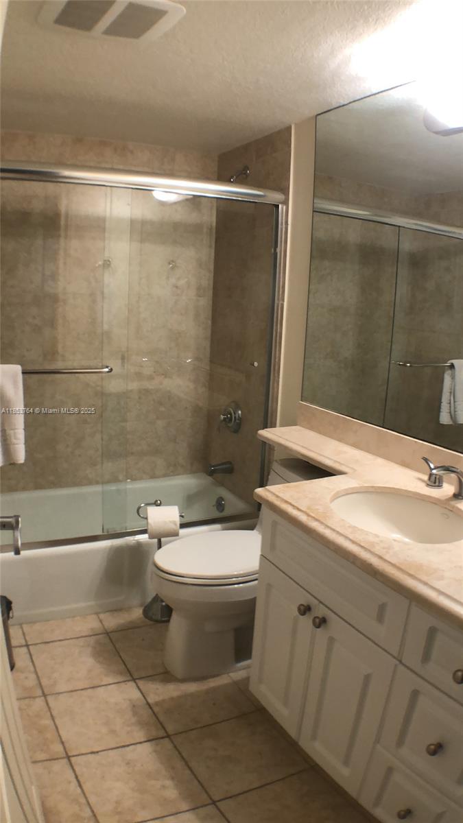 151 Crandon Boulevard, Unit 833 Key Biscayne, FL 33149 - Photo 9 of 12 a bathroom with a sink a toilet and shower