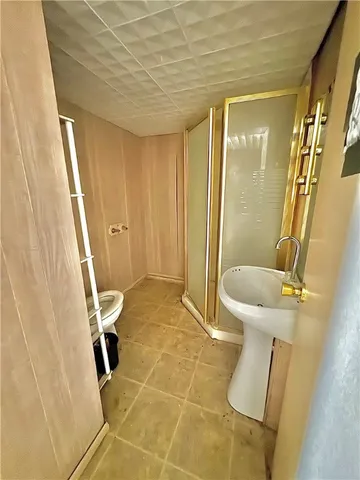 a bathroom with a sink and toilet