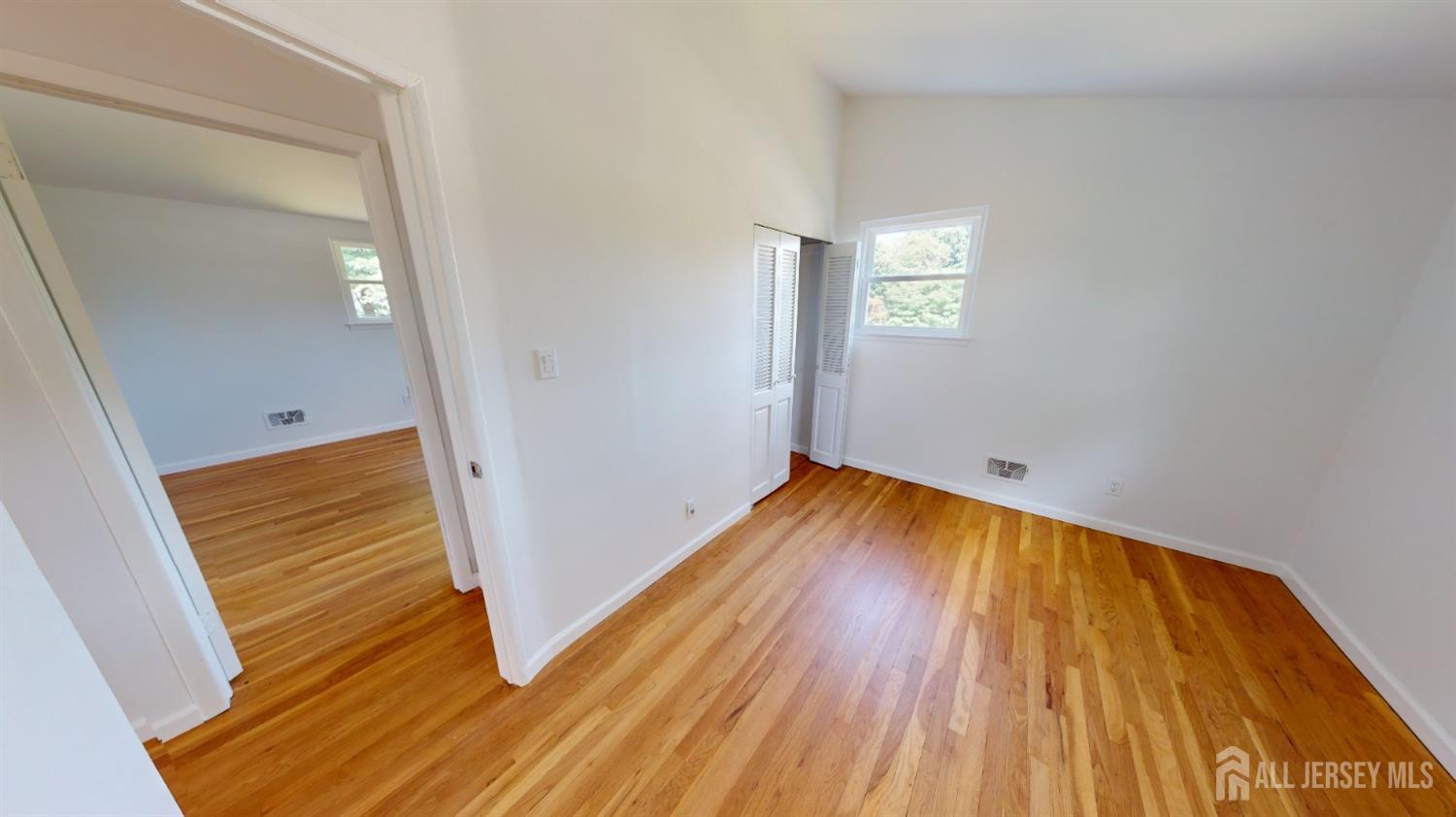3 Donald Road East Brunswick, NJ 08816 - Photo 28 of 62 a view of a hallway with wooden floor and stairs
