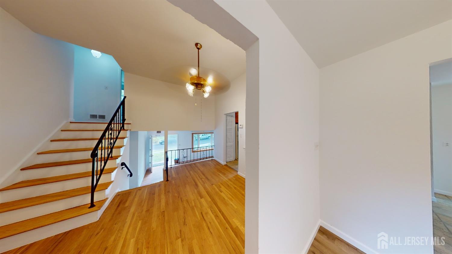 3 Donald Road East Brunswick, NJ 08816 - Photo 33 of 62 a view of a livingroom with wooden floor and staircase