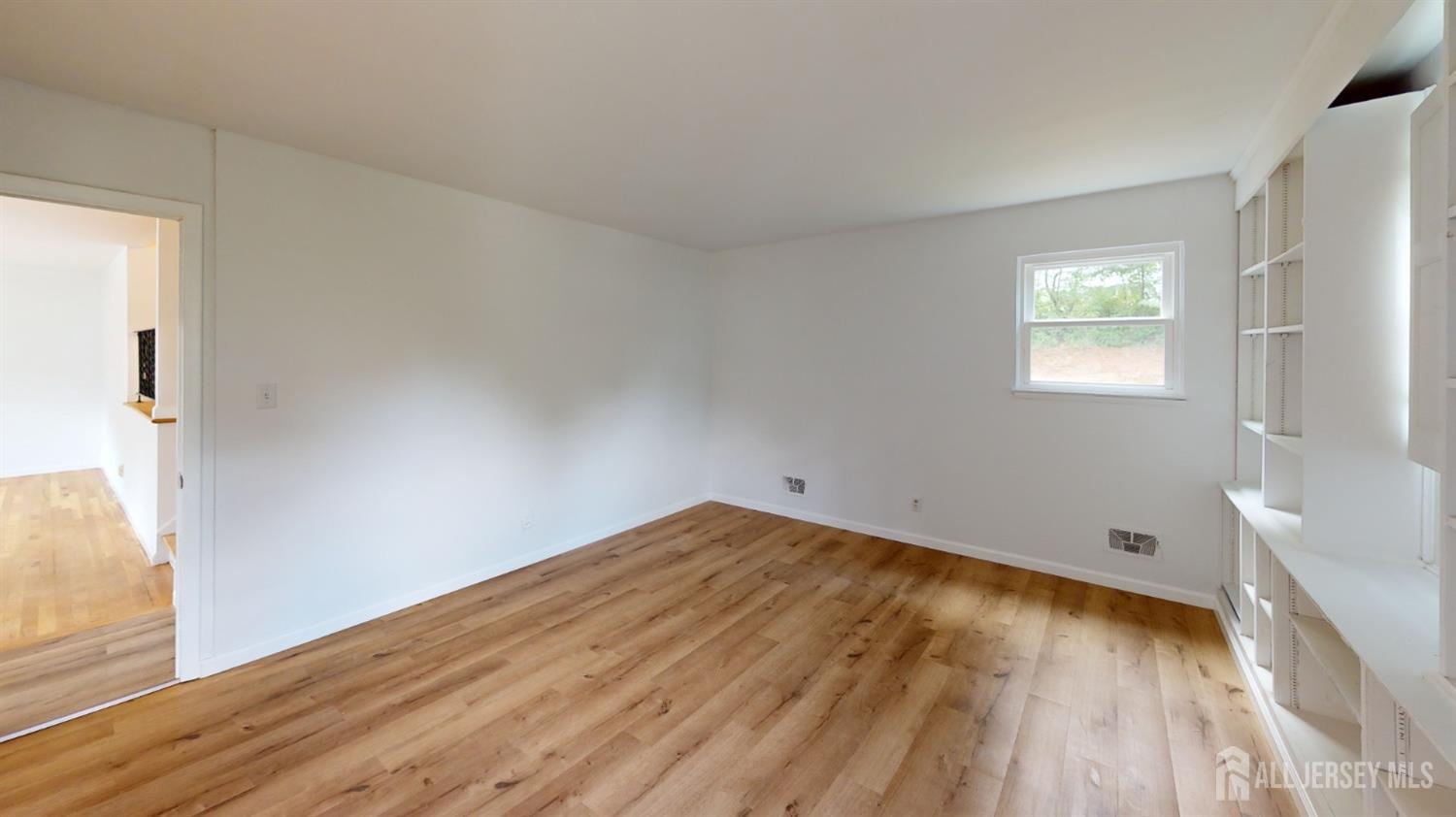 3 Donald Road East Brunswick, NJ 08816 - Photo 45 of 62 a view of empty room with wooden floor and fan