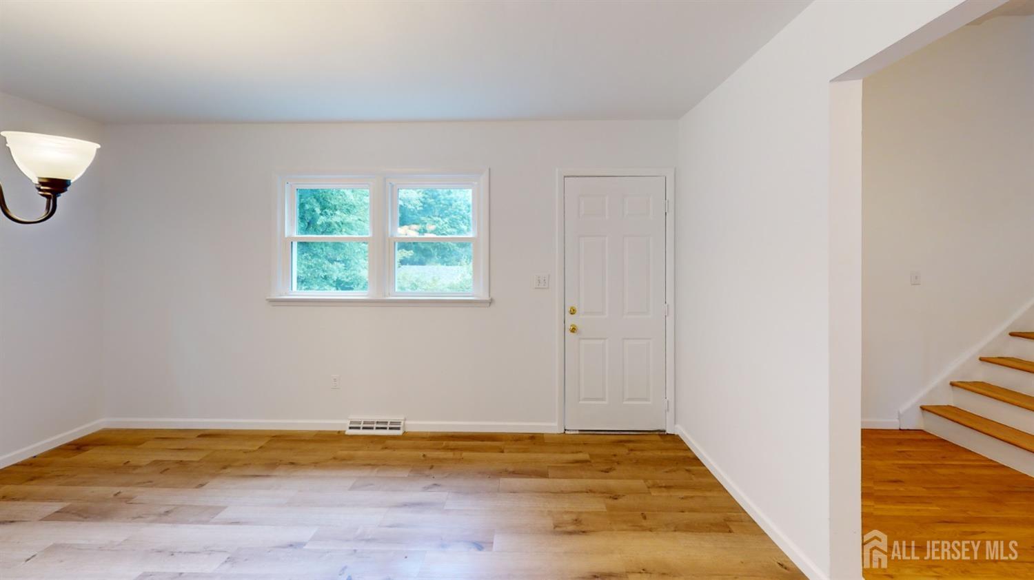 3 Donald Road East Brunswick, NJ 08816 - Photo 52 of 62 a view of empty room with wooden floor and fan