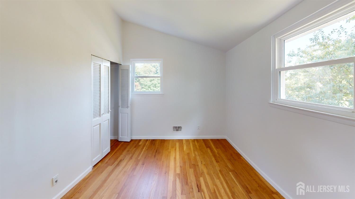 3 Donald Road East Brunswick, NJ 08816 - Photo 54 of 62 an empty room with wooden floor and windows