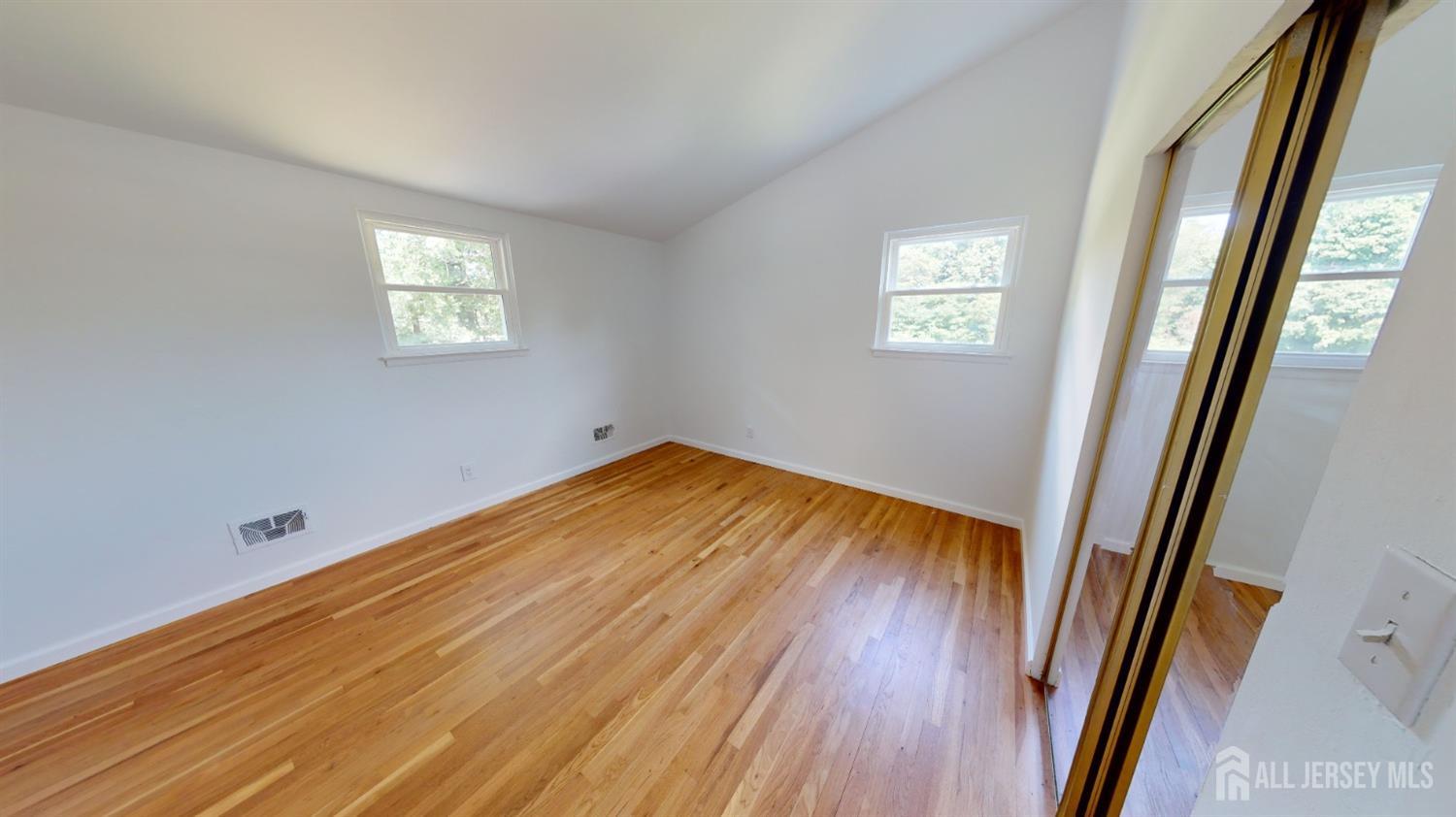 3 Donald Road East Brunswick, NJ 08816 - Photo 61 of 62 a view of a room with wooden floor and a window