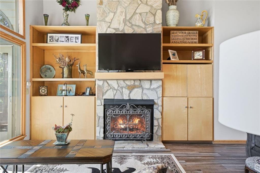 251 Panorama Point Jasper, GA 30143 - Photo 22 of 93 a living room with a fireplace and a flat screen tv