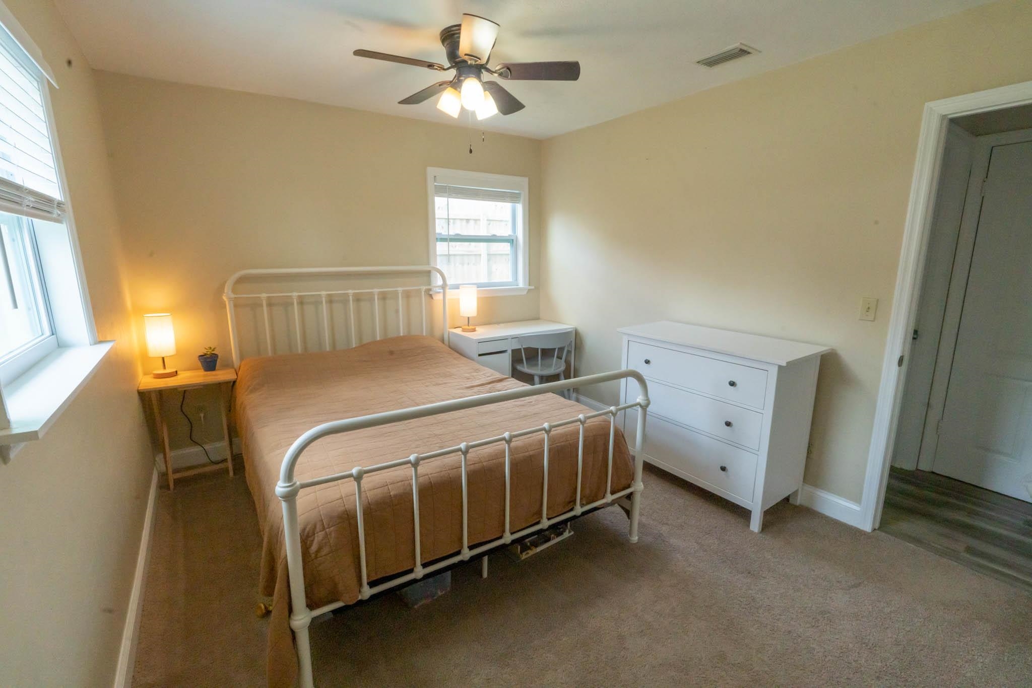 116 15th Street St. Augustine Beach, FL 32080 - Photo 12 of 20 a bed sitting in a bedroom next to a window