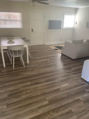 a living room with wooden floor