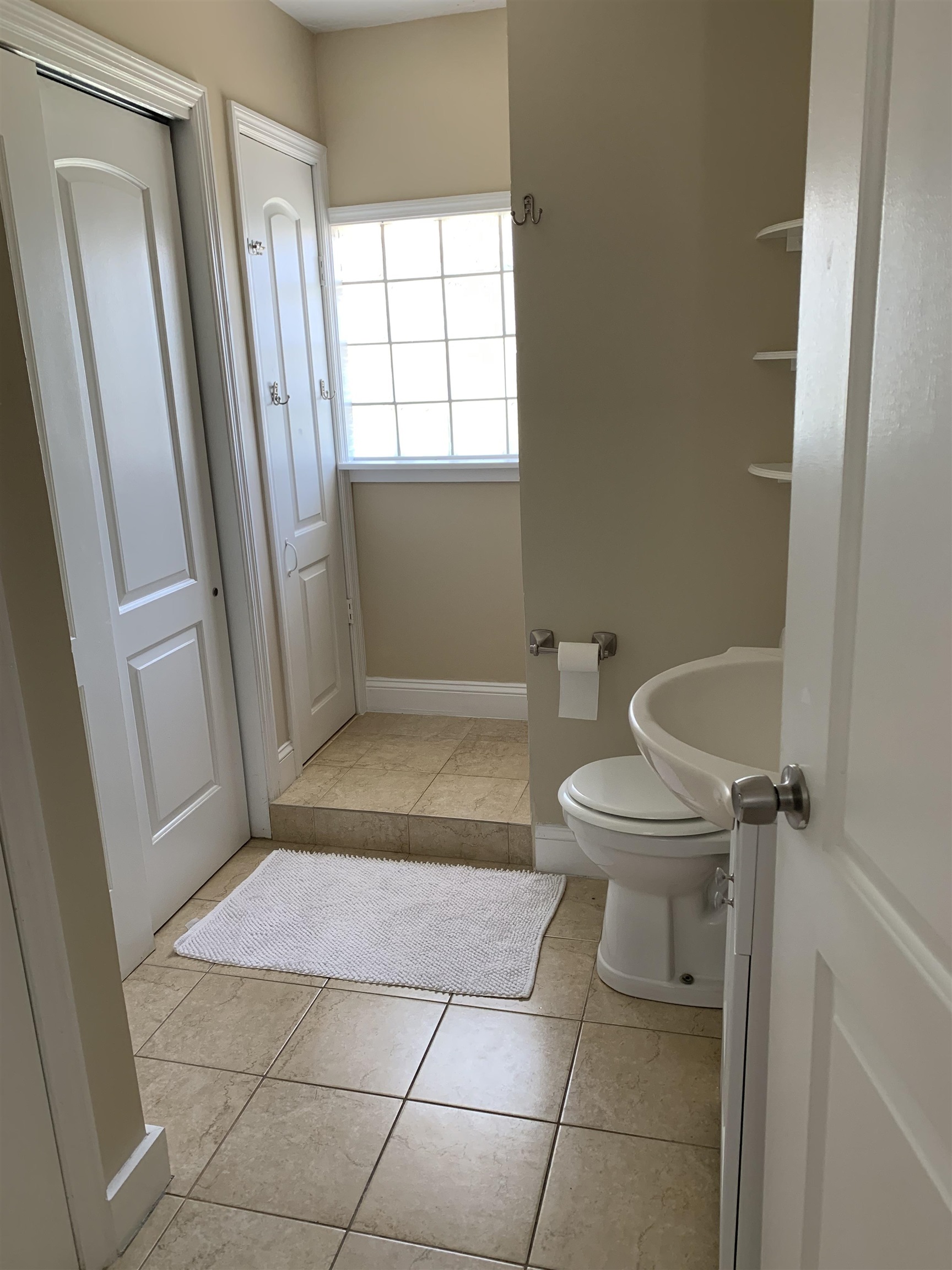 116 15th Street St. Augustine Beach, FL 32080 - Photo 9 of 20 a bathroom with a toilet and a shower