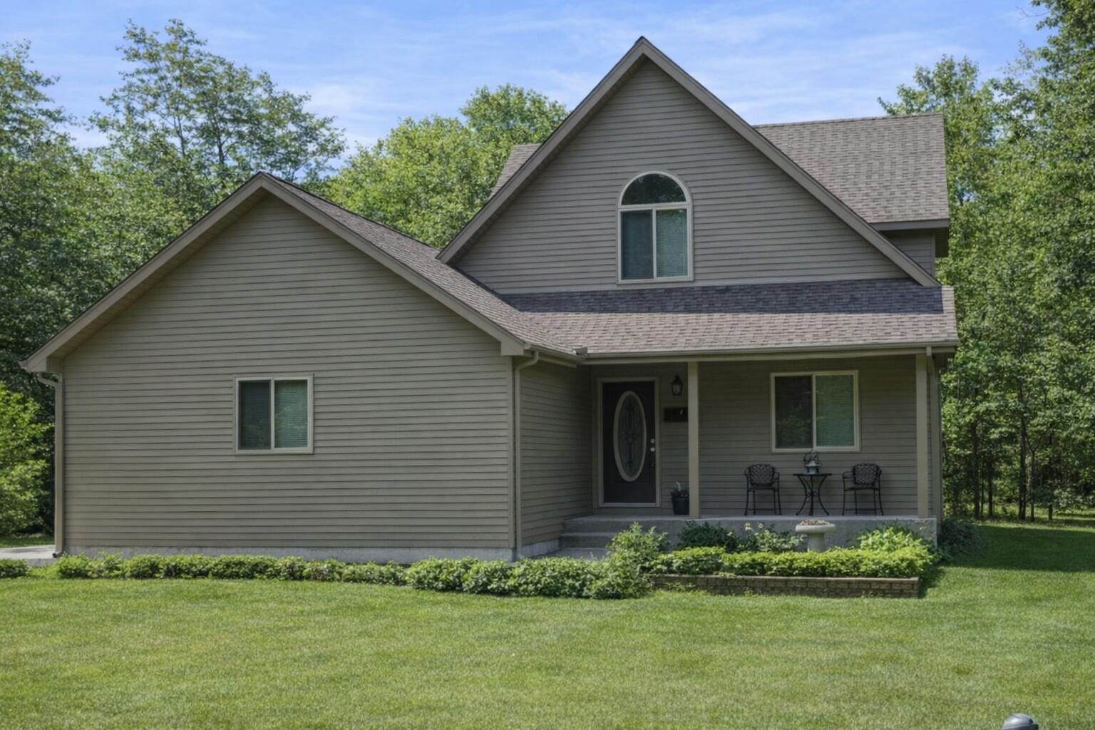 a front view of a house with a yard