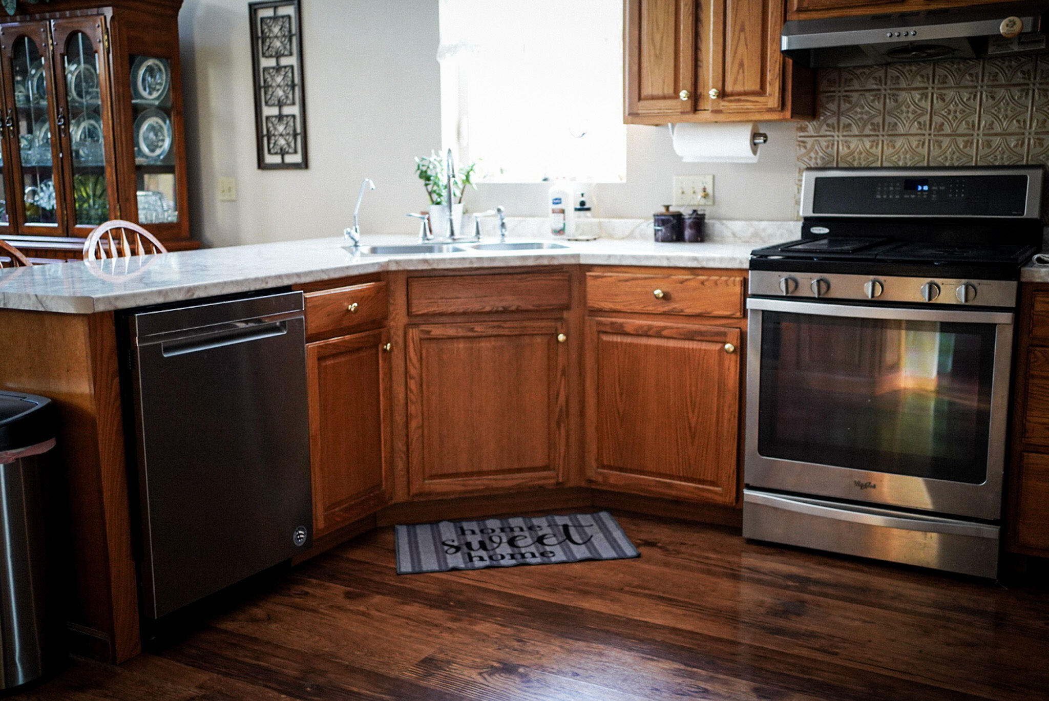 10847 West 700 South Rensselaer, IN 47978 - Photo 5 of 12 a kitchen with granite countertop a stove and a sink