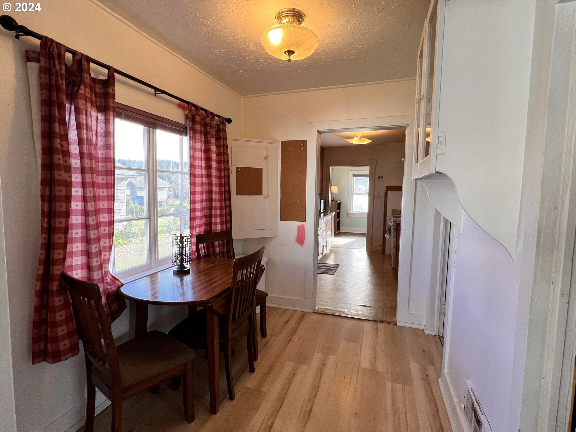 2149 Dogwood Avenue Reedsport, OR 97467 - Photo 14 of 41 a view of a dining room with furniture window and wooden floor