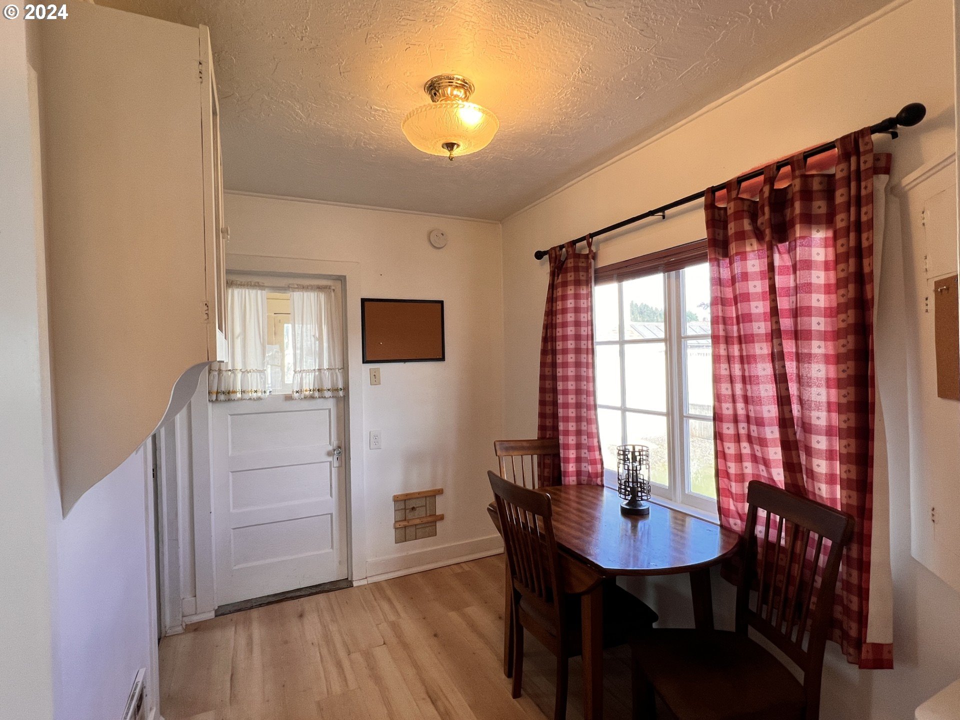 2149 Dogwood Avenue Reedsport, OR 97467 - Photo 15 of 41 a view of a dining room with furniture and window
