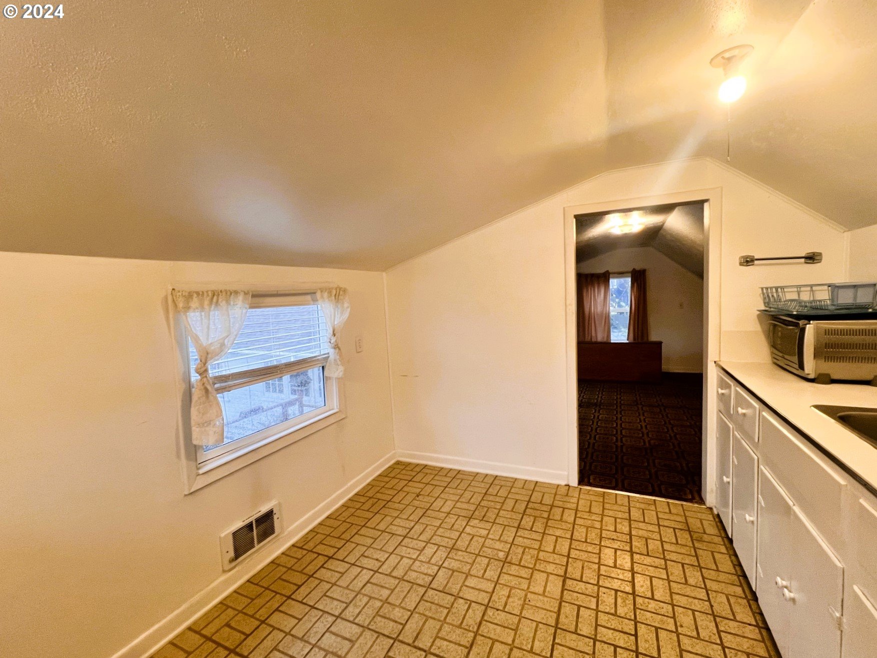 2149 Dogwood Avenue Reedsport, OR 97467 - Photo 32 of 41 a view of a hallway and a livingroom with wooden floor