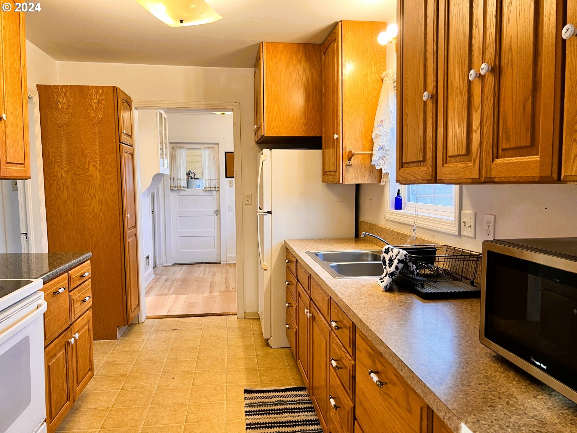 2149 Dogwood Avenue Reedsport, OR 97467 - Photo 9 of 41 a kitchen that has a sink and a stove