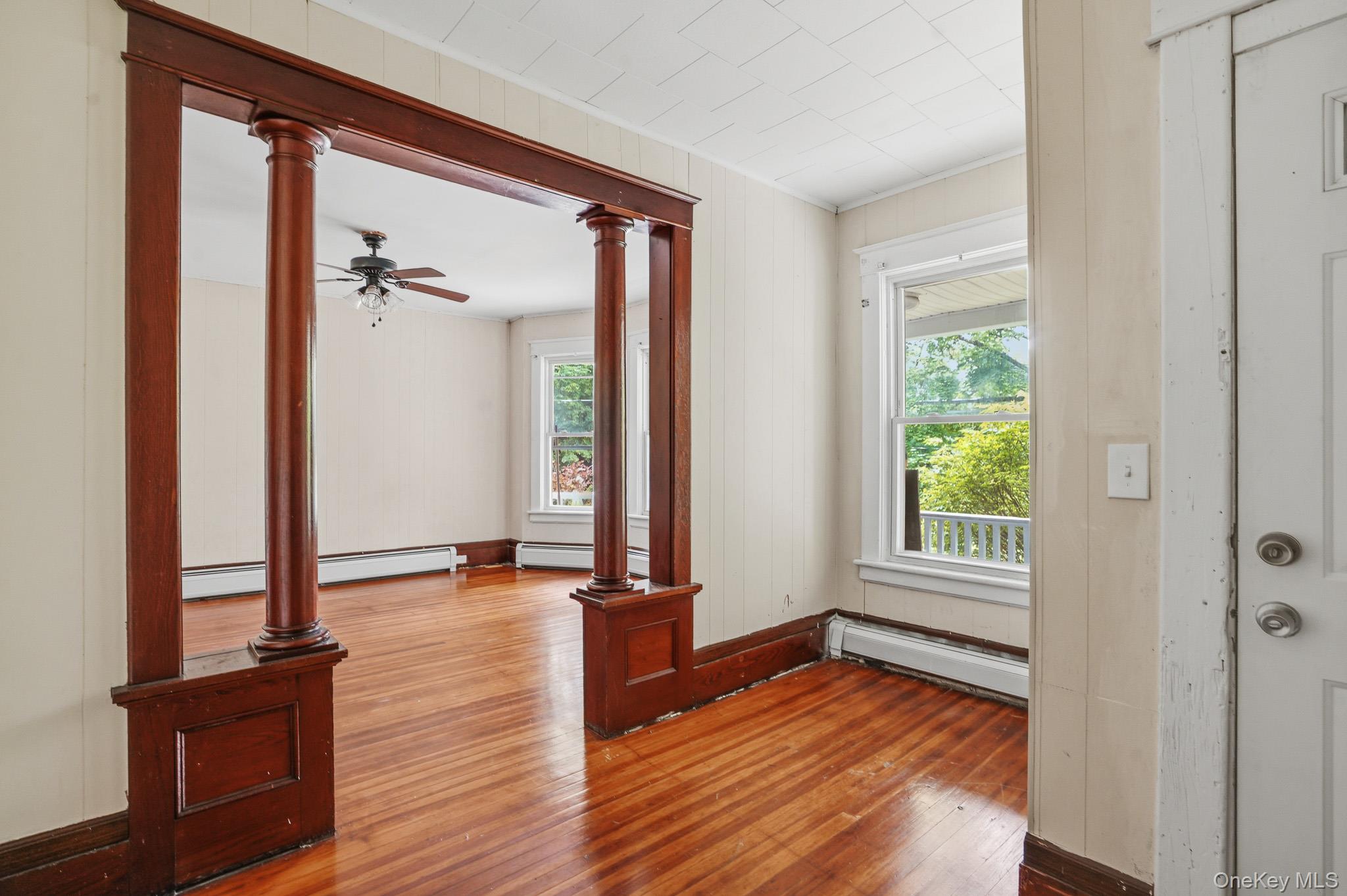 65 North Clinton Street Poughkeepsie, NY 12601 - Photo 6 of 43 a view of an empty room with wooden floor and a window