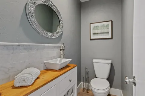 a bathroom with a toilet and a sink