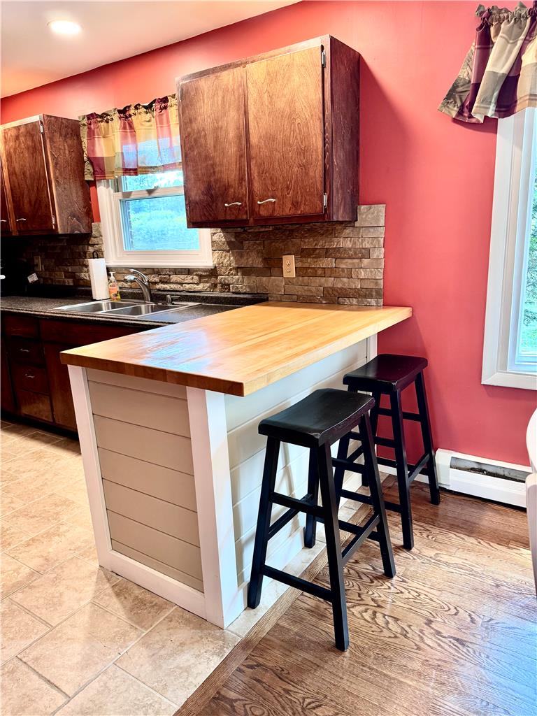 5334 Egypt Road Laurys Station, PA 18059 - Photo 13 of 55 A well-appointed kitchen features a practical breakfast bar and a deep double sink with a window view.