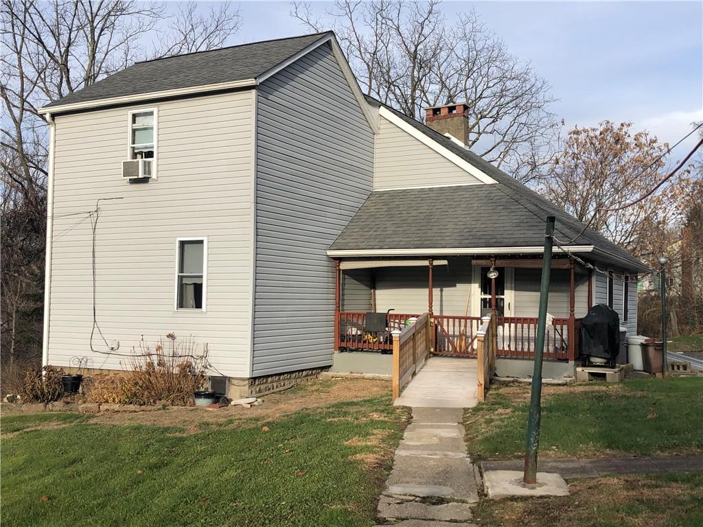374 Ferguson Road Dunbar, PA 15431 - Photo 18 of 21 a front view of house with yard