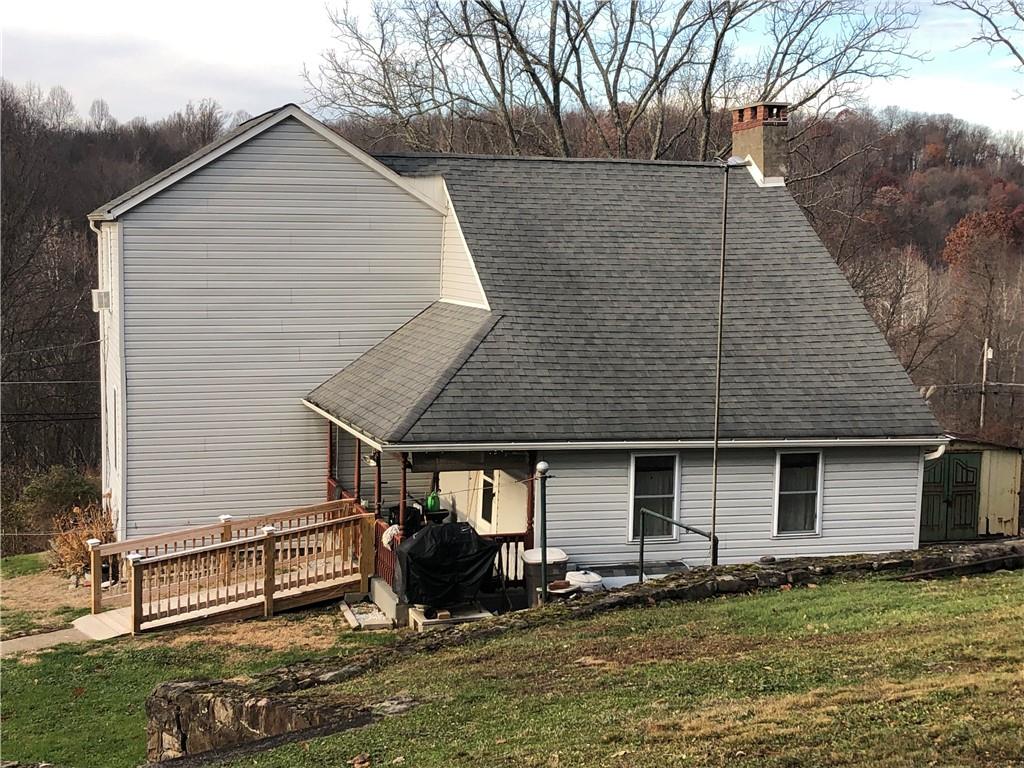 374 Ferguson Road Dunbar, PA 15431 - Photo 19 of 21 a backyard of a house with yard and garage