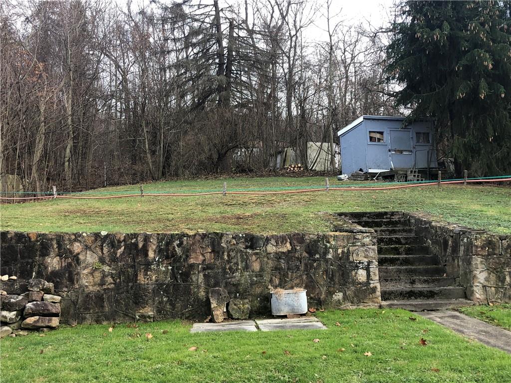 374 Ferguson Road Dunbar, PA 15431 - Photo 21 of 21 a view of a golf course with a table and chairs